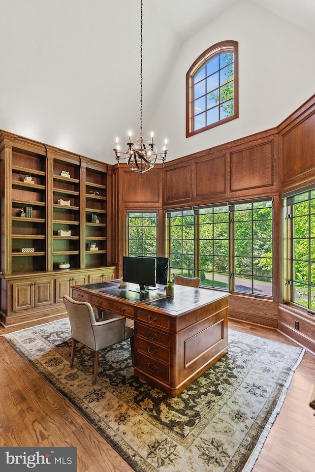11820 Plantation Dr, Great Falls, VA 22066 - office area with wood finished floors, a chandelier, and high vaulted ceiling