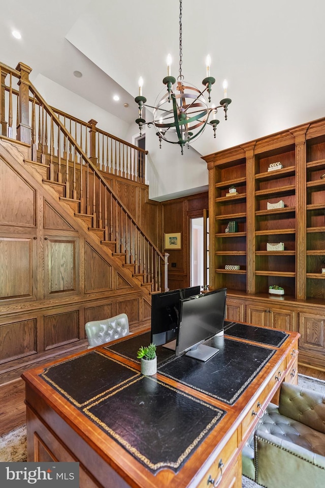 11820 Plantation Dr, Great Falls, VA 22066 - dining room featuring wooden walls, an inviting chandelier, stairs, recessed lighting, and wood finished floors