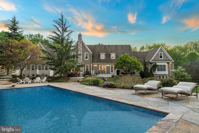 11820 Plantation Dr, Great Falls, VA 22066 - pool at dusk featuring a patio and an outdoor pool