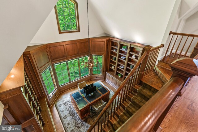 11820 Plantation Dr, Great Falls, VA 22066 - interior space featuring wood finished floors, a chandelier, and vaulted ceiling