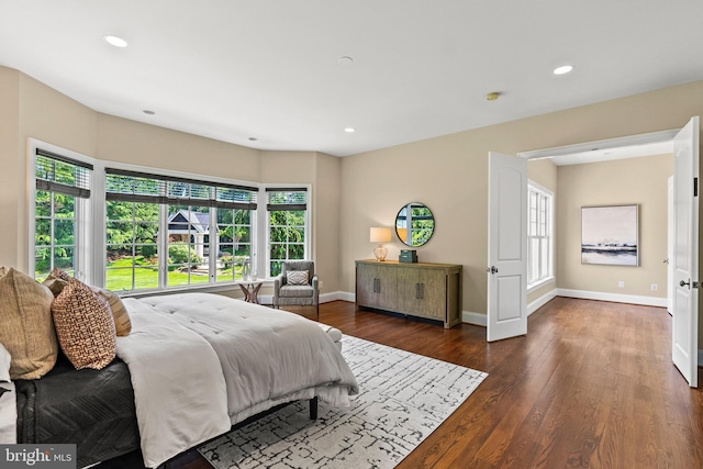 11820 Plantation Dr, Great Falls, VA 22066 - bedroom featuring baseboards, multiple windows, and wood finished floors