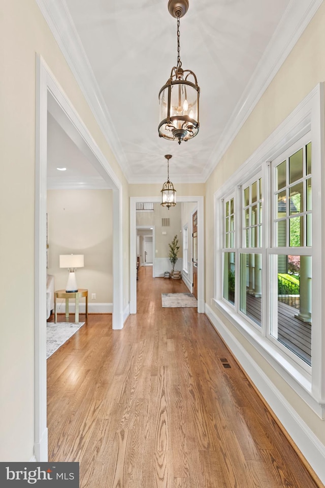 11820 Plantation Dr, Great Falls, VA 22066 - foyer entrance featuring visible vents, crown molding, baseboards, a chandelier, and light wood-style flooring