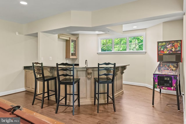 11820 Plantation Dr, Great Falls, VA 22066 - bar with a sink, recessed lighting, baseboards, wet bar, and wood finished floors
