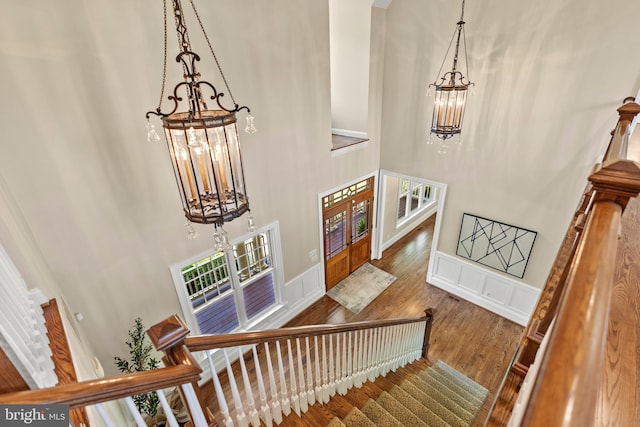 11820 Plantation Dr, Great Falls, VA 22066 - entryway with a chandelier, french doors, stairs, wood finished floors, and a towering ceiling