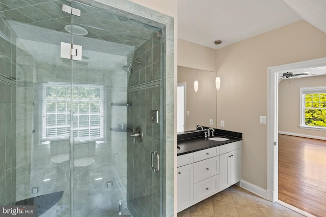 11820 Plantation Dr, Great Falls, VA 22066 - bathroom featuring vanity, baseboards, tile patterned flooring, and a shower stall