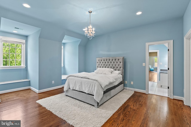 11820 Plantation Dr, Great Falls, VA 22066 - bedroom with baseboards, visible vents, an inviting chandelier, and wood finished floors