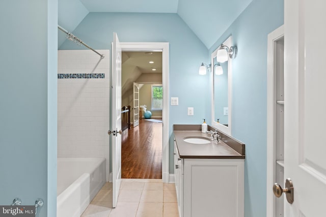 11820 Plantation Dr, Great Falls, VA 22066 - full bathroom featuring vanity, tile patterned floors, lofted ceiling, and tub / shower combination
