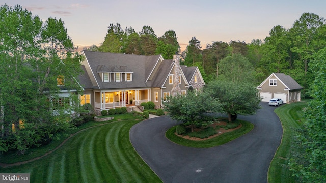 11820 Plantation Dr, Great Falls, VA 22066 - shingle-style home with a garage, an outbuilding, driveway, and covered porch