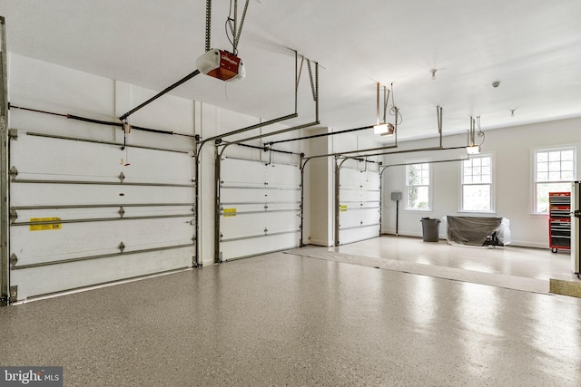 11820 Plantation Dr, Great Falls, VA 22066 - garage with baseboards and a garage door opener
