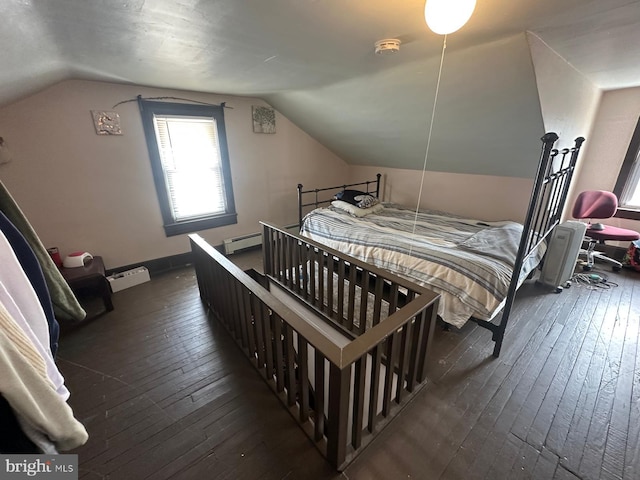 bedroom featuring lofted ceiling, dark wood-style floors, and baseboard heating