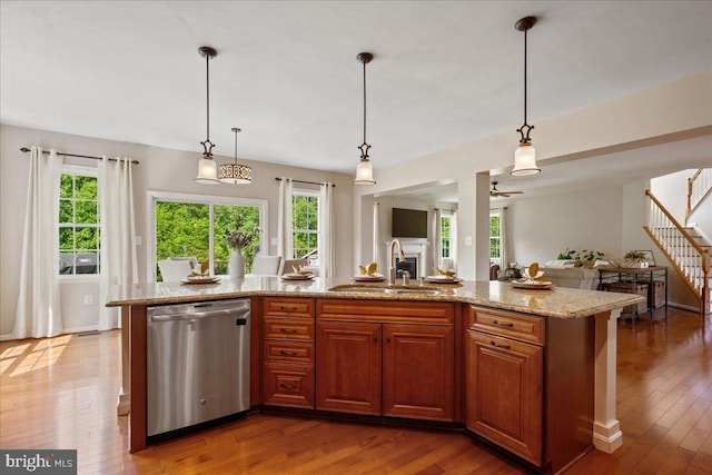 12670 Perrywood Ln, Dunkirk, MD 20754 - kitchen featuring stainless steel dishwasher, a sink, open floor plan, and healthy amount of natural light