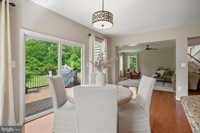12670 Perrywood Ln, Dunkirk, MD 20754 - dining area featuring stairs, a ceiling fan, and wood-type flooring