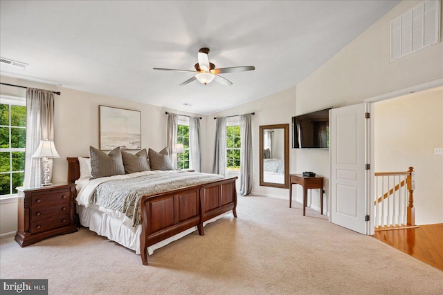 12670 Perrywood Ln, Dunkirk, MD 20754 - bedroom with multiple windows, lofted ceiling, light carpet, ceiling fan, and baseboards