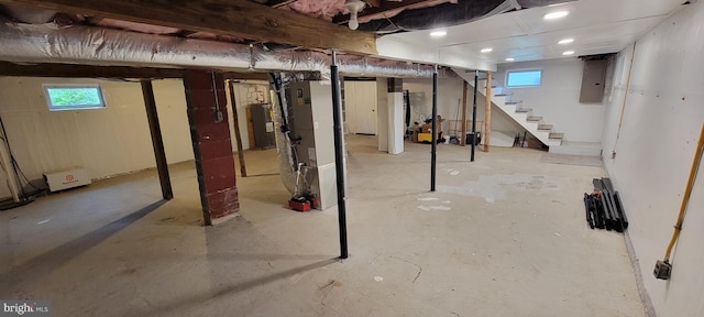 2920 Dares Beach Rd, Prince Frederick, MD 20678 - basement featuring stairs, healthy amount of natural light, electric water heater, and heating unit