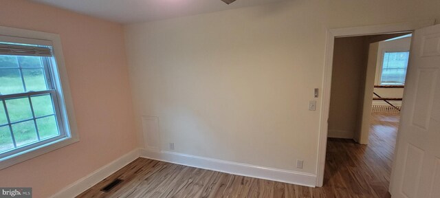 2920 Dares Beach Rd, Prince Frederick, MD 20678 - spare room featuring wood finished floors, baseboards, and healthy amount of natural light