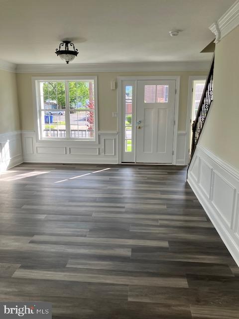 111 Heulings Ave, Riverside, NJ 08075 - entrance foyer with a decorative wall, wainscoting, crown molding, stairway, and dark wood-type flooring
