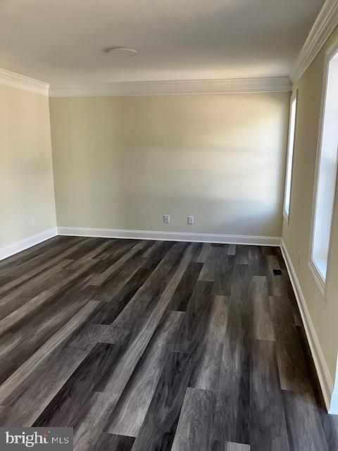 111 Heulings Ave, Riverside, NJ 08075 - spare room featuring ornamental molding, baseboards, and dark wood-style floors