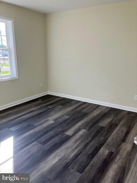 111 Heulings Ave, Riverside, NJ 08075 - unfurnished room with baseboards and dark wood finished floors