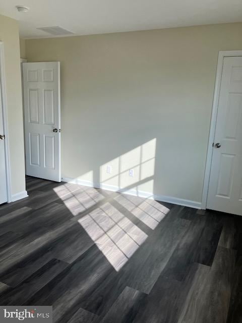 111 Heulings Ave, Riverside, NJ 08075 - unfurnished room featuring baseboards, dark wood finished floors, and a smoke detector