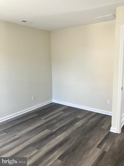 111 Heulings Ave, Riverside, NJ 08075 - unfurnished room with baseboards and dark wood-type flooring