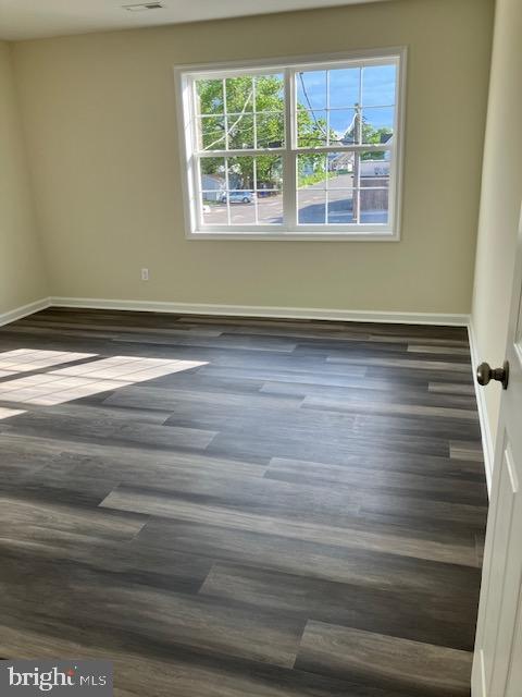 111 Heulings Ave, Riverside, NJ 08075 - spare room with dark wood-style floors and baseboards