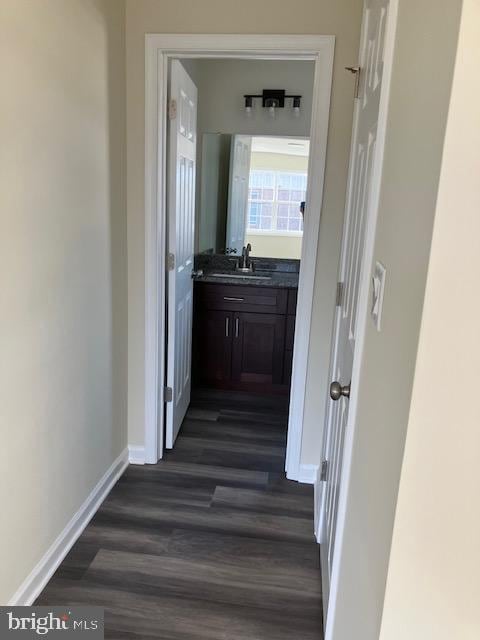 111 Heulings Ave, Riverside, NJ 08075 - corridor featuring dark wood-style flooring, a sink, and baseboards