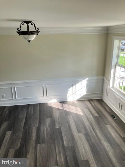 111 Heulings Ave, Riverside, NJ 08075 - spare room featuring a wainscoted wall, a decorative wall, and dark wood-style floors