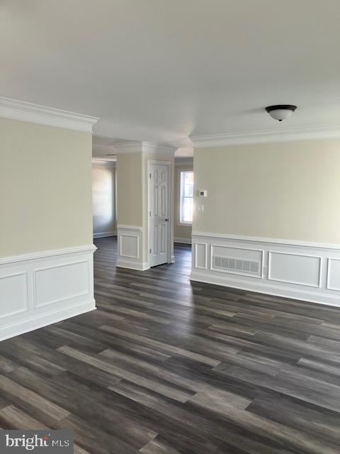 111 Heulings Ave, Riverside, NJ 08075 - empty room featuring ornamental molding, dark wood-type flooring, wainscoting, and a decorative wall