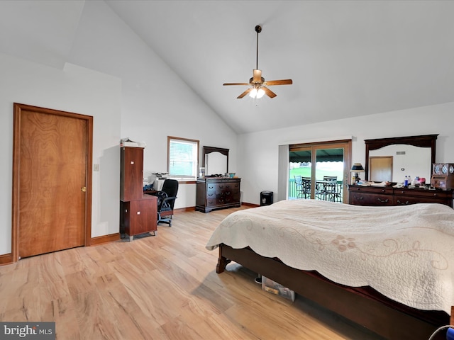 bedroom featuring high vaulted ceiling, multiple windows, access to exterior, and wood finished floors