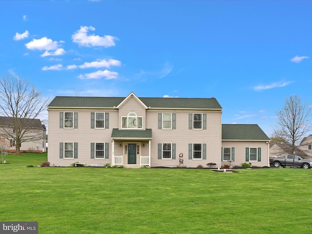 colonial home with a front lawn