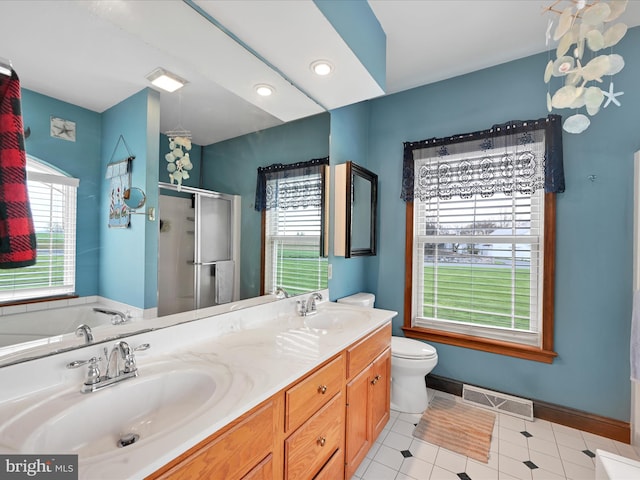 full bathroom featuring a shower stall, a wealth of natural light, visible vents, and a sink