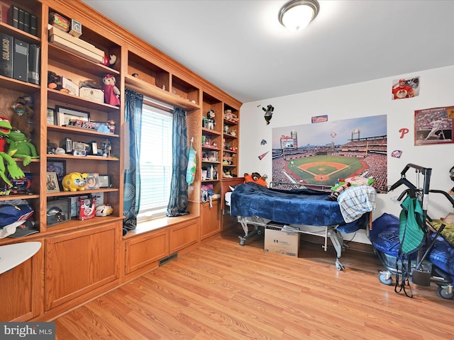 bedroom featuring light wood-style floors