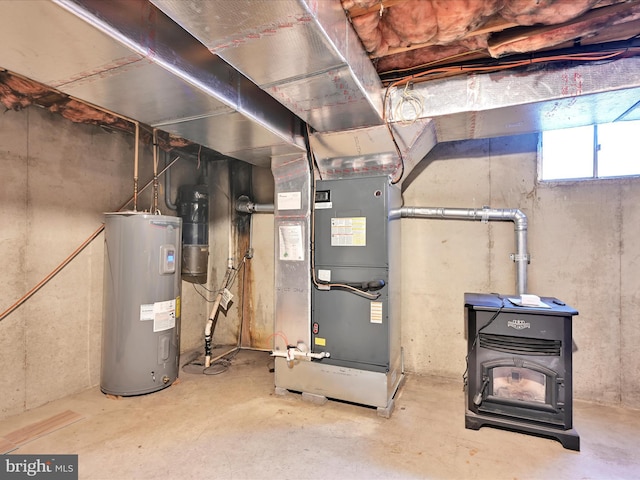 utility room with water heater and heating unit