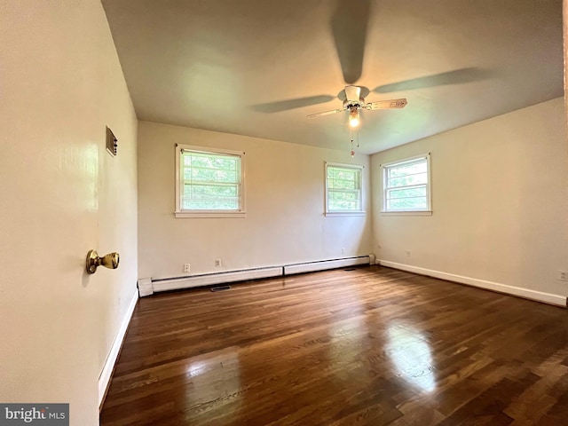 13306 Partridge Dr, Silver Spring, MD 20904 - spare room featuring a baseboard radiator, healthy amount of natural light, a ceiling fan, and dark wood finished floors