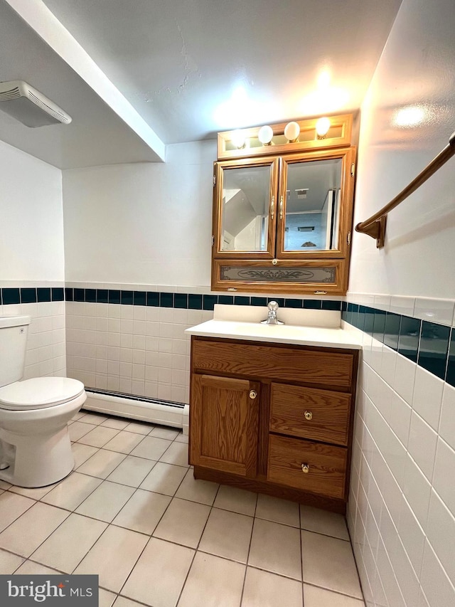 13306 Partridge Dr, Silver Spring, MD 20904 - bathroom featuring a baseboard radiator, tile walls, vanity, wainscoting, and tile patterned flooring