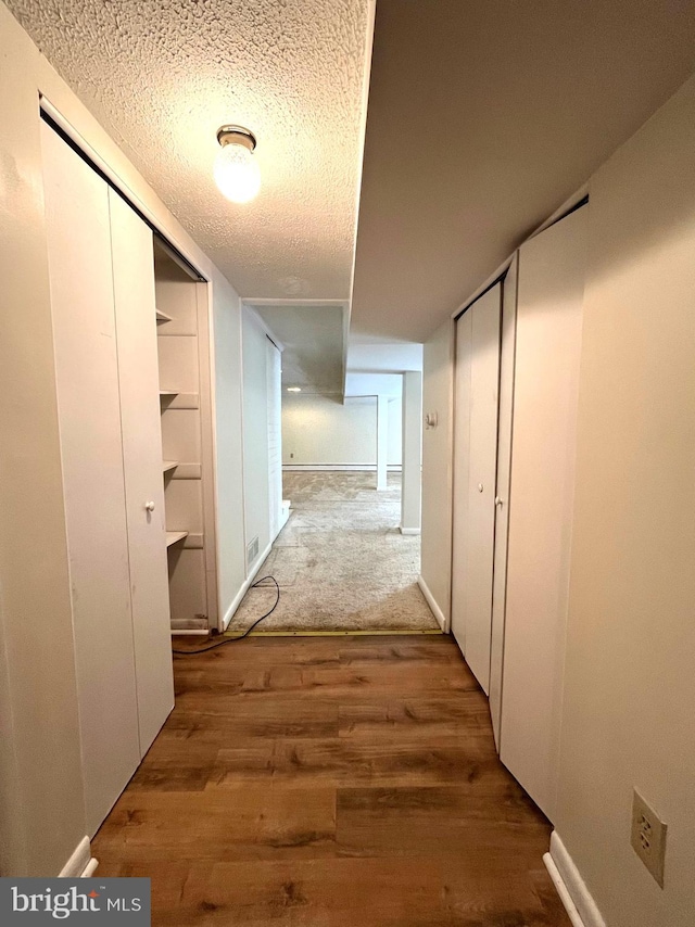 13306 Partridge Dr, Silver Spring, MD 20904 - hallway with wood finished floors and a textured ceiling