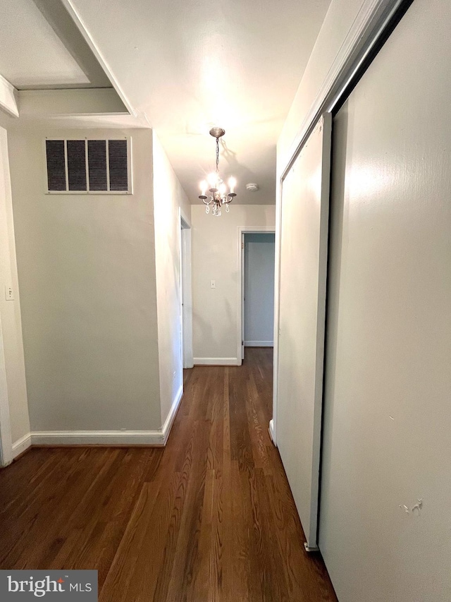 13306 Partridge Dr, Silver Spring, MD 20904 - hall with a chandelier, wood finished floors, and baseboards
