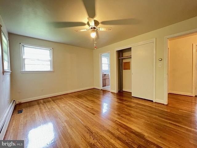 13306 Partridge Dr, Silver Spring, MD 20904 - unfurnished bedroom with baseboard heating, wood finished floors, baseboards, and a closet