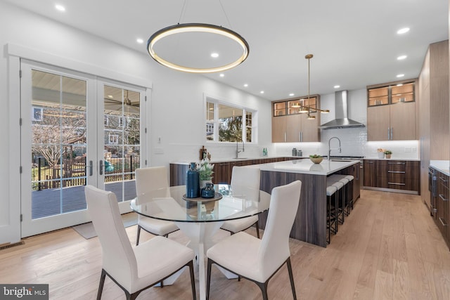 dining room featuring visible vents, light wood-style floors, and recessed lighting