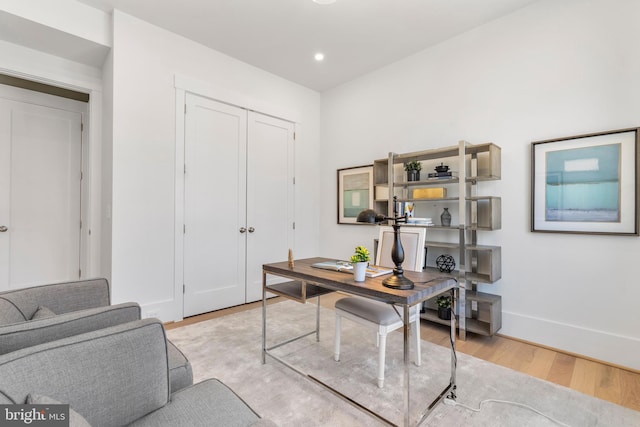 office area featuring baseboards, wood finished floors, and recessed lighting