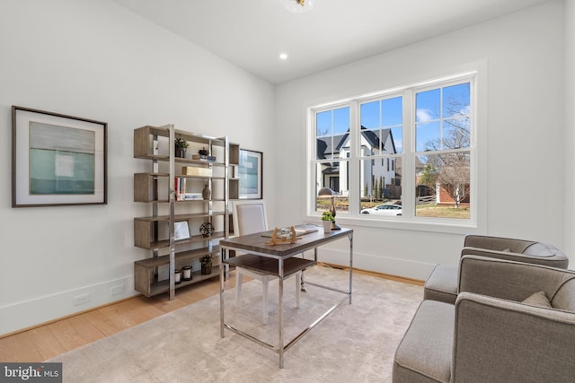 home office featuring baseboards, wood finished floors, and recessed lighting