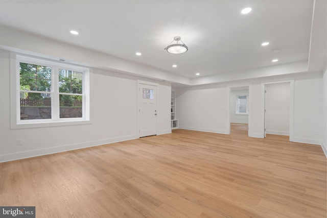 interior space featuring light wood-style flooring, visible vents, baseboards, and recessed lighting