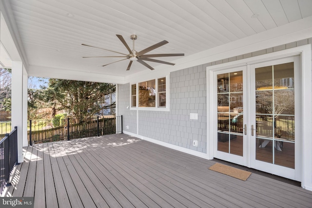 wooden terrace featuring ceiling fan