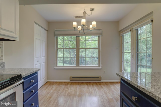 2 Rainflower Path Unit 102, Sparks Glencoe, MD 21152 - kitchen with blue cabinets, a baseboard heating unit, light wood finished floors, and plenty of natural light