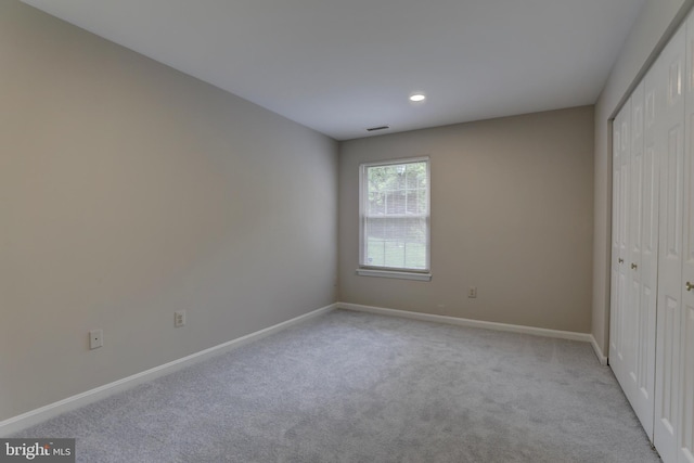 2 Rainflower Path Unit 102, Sparks Glencoe, MD 21152 - unfurnished bedroom featuring light carpet, a closet, baseboards, and recessed lighting