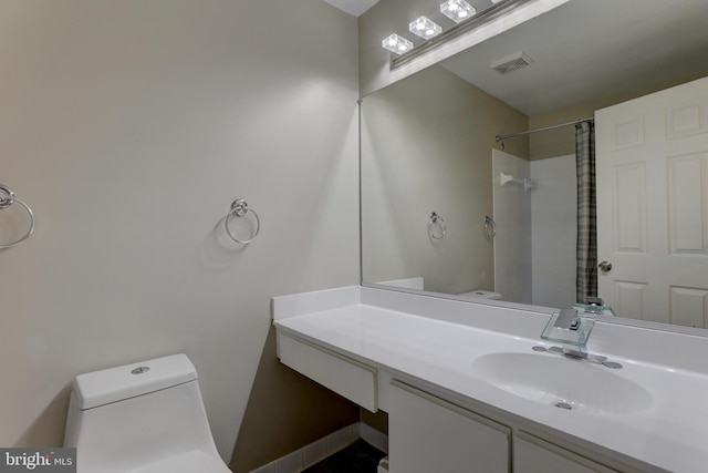2 Rainflower Path Unit 102, Sparks Glencoe, MD 21152 - bathroom featuring toilet, vanity, and a shower with curtain