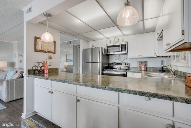 107 Convention Center Dr Unit 161D, Ocean City, MD 21842 - kitchen with a sink, white cabinets, appliances with stainless steel finishes, and dark wood-type flooring