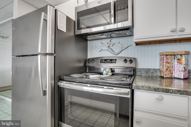 107 Convention Center Dr Unit 161D, Ocean City, MD 21842 - kitchen featuring white cabinetry, dark countertops, and stainless steel appliances