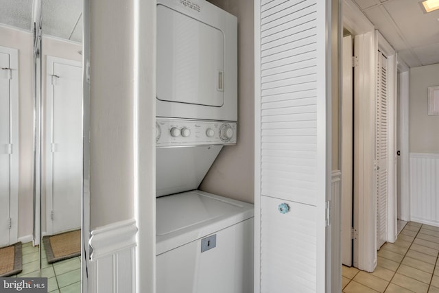 107 Convention Center Dr Unit 161D, Ocean City, MD 21842 - washroom featuring light tile patterned flooring, stacked washing maching and dryer, and laundry area