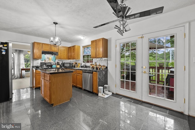 9525 Queens Guard Ct, Laurel, MD 20723 - kitchen featuring appliances with stainless steel finishes, granite tiled floors, french doors, extractor fan, and dark countertops